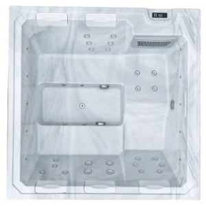 Top view of the JJSPA Beta 414 hot tub with a white marble-effect shell, seats, massage jets and headrests.